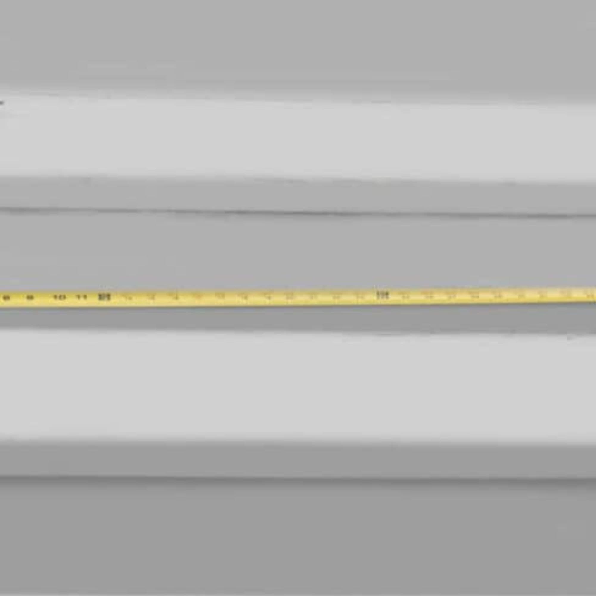 A tape measure measuring a step horizontally.
