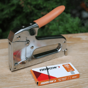 The Arrow T25 Low Voltage Cable Staple Gun with matching staples.